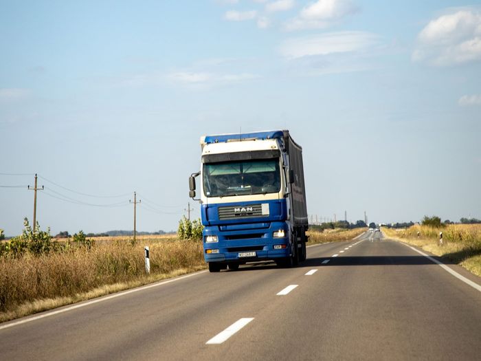Curtainside truck on a European road